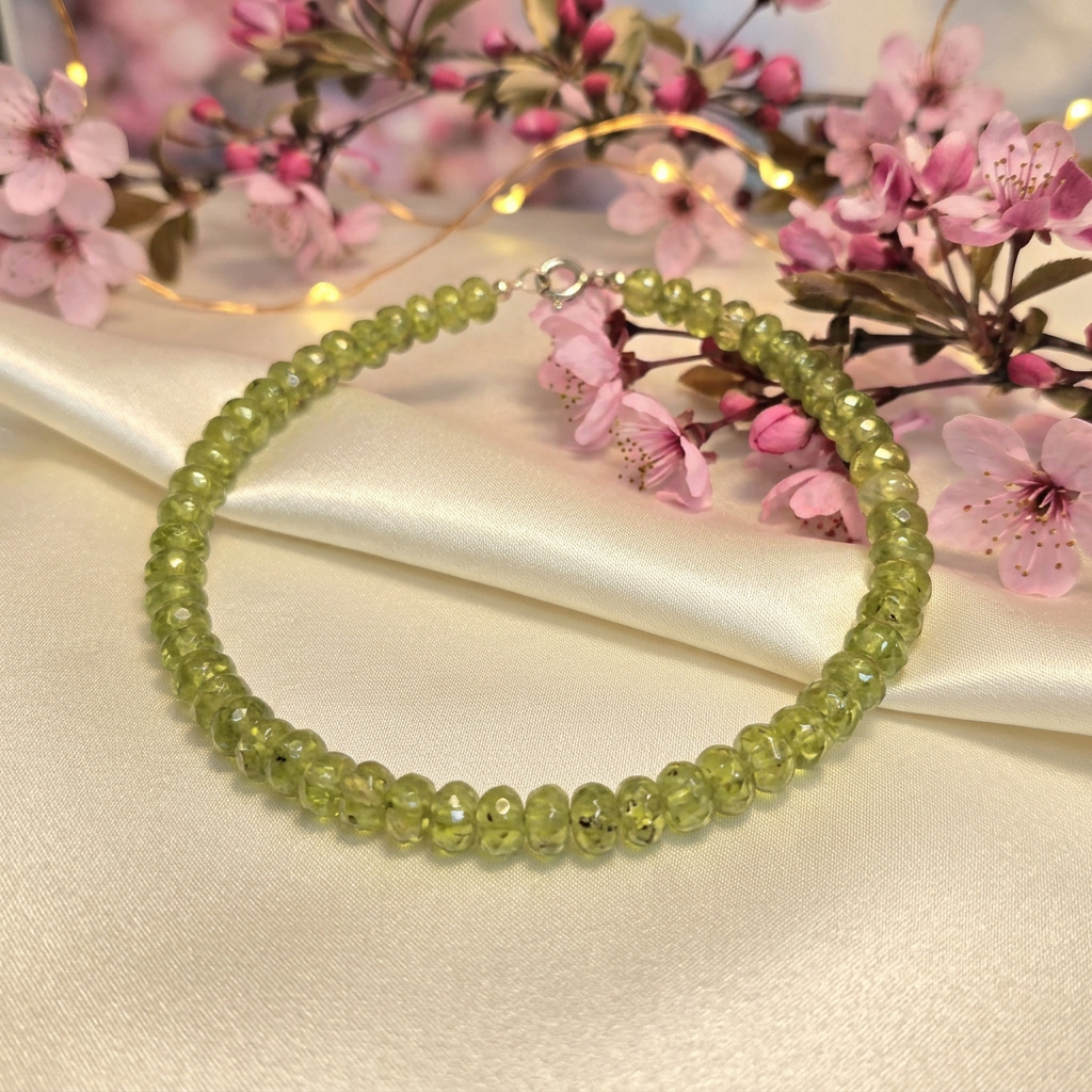 Peridot bracelet with pink cherry blossoms and golden lights