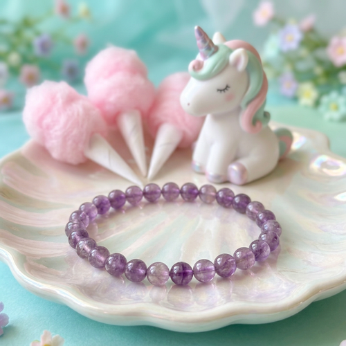 Amethyst bracelet in a cotton candy garden with a unicorn