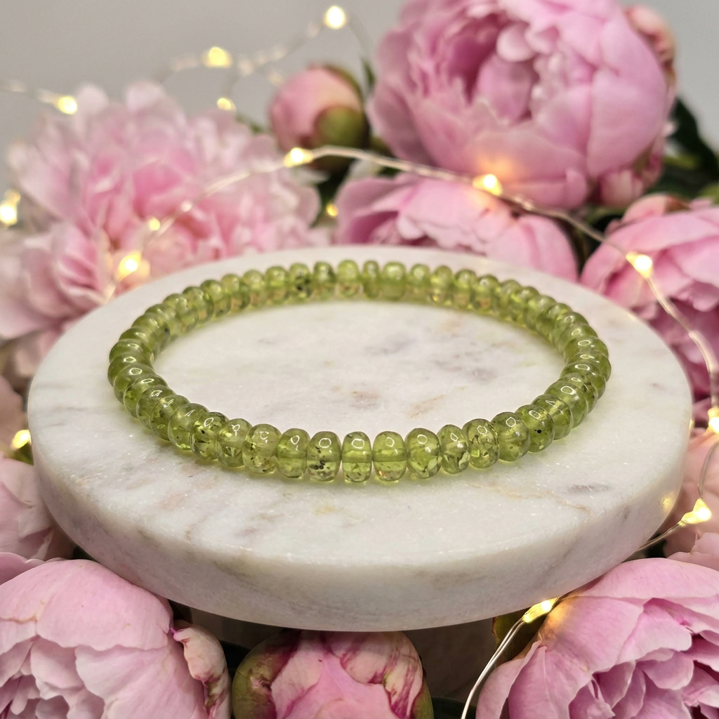 Peridot bracelet with pink peonies and glowing lights