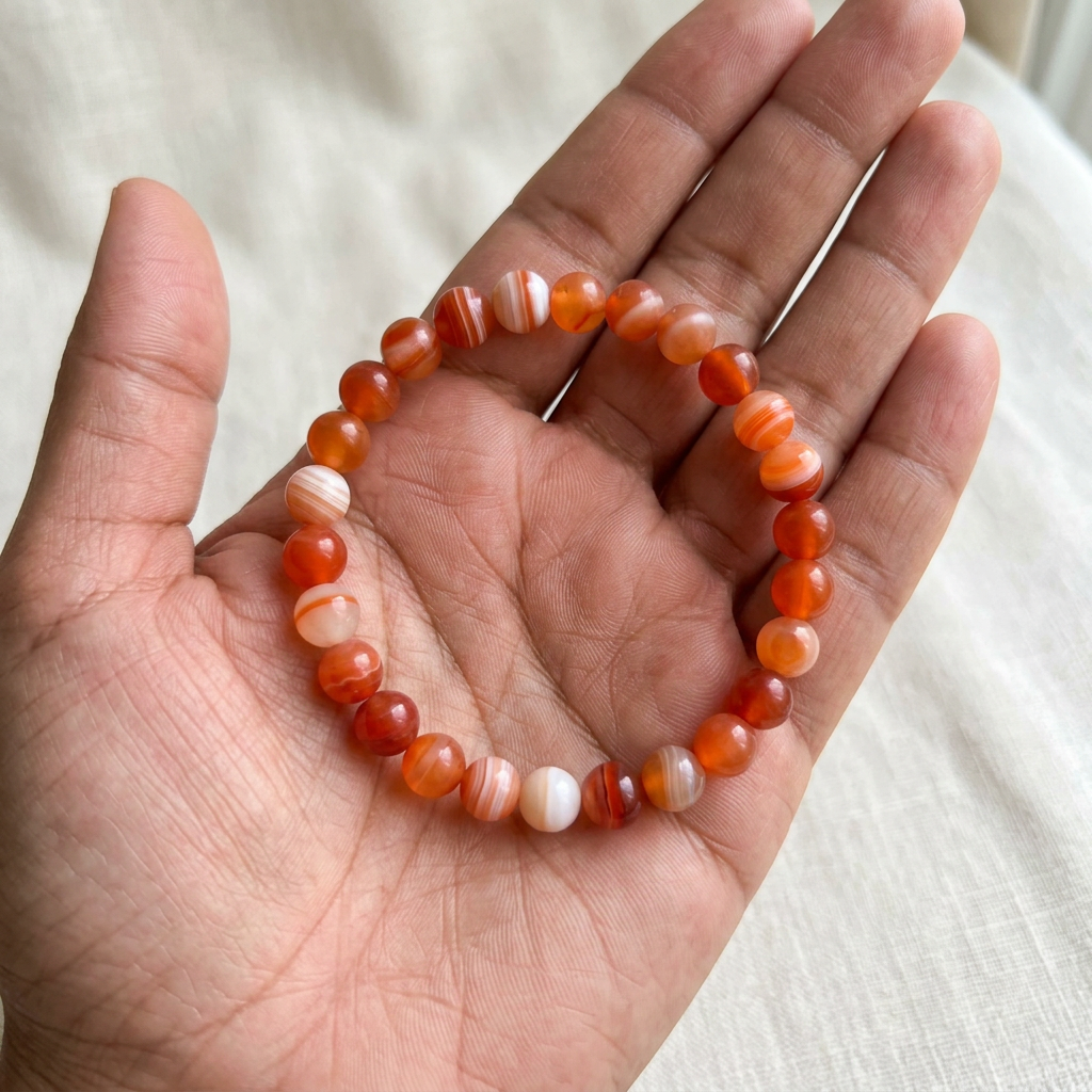 Sardonyx bracelet resting in an open palm