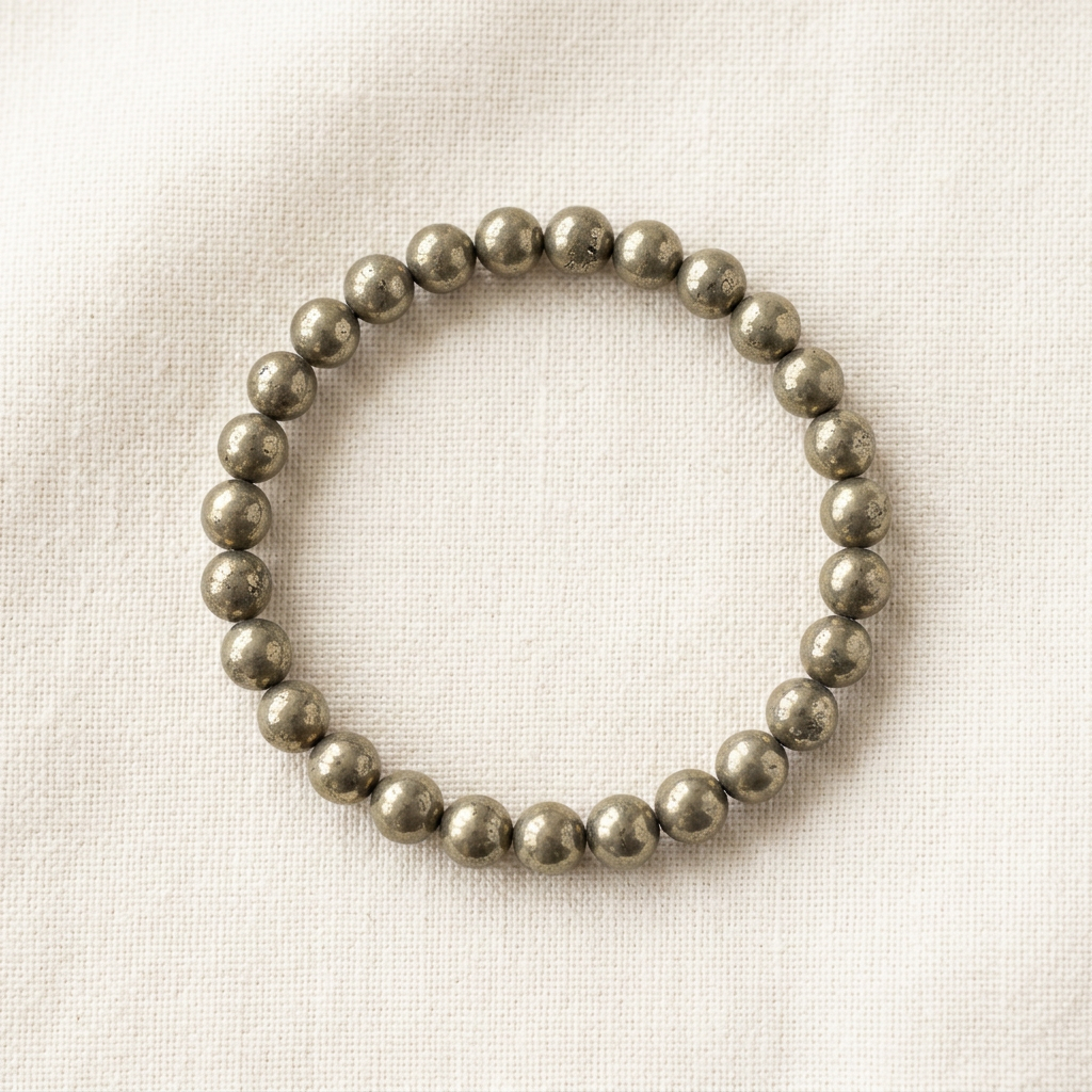 Pyrite bracelet styled on ivory linen
